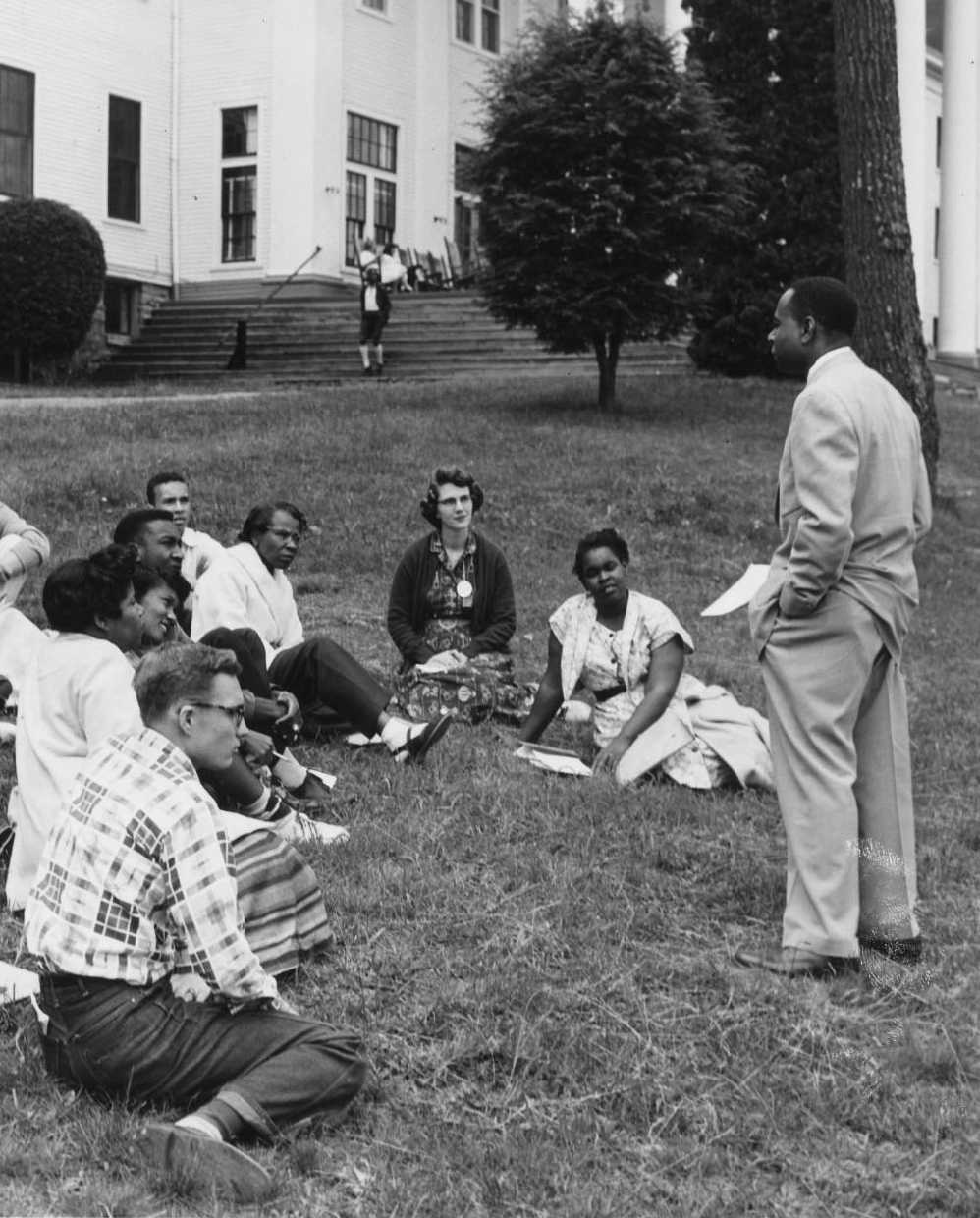 This photograph is of L. Maynard Catchings meeting with a group of students affiliated with the YMCA and YWCA. The original image can be found here: http://purl.umn.edu/77727.