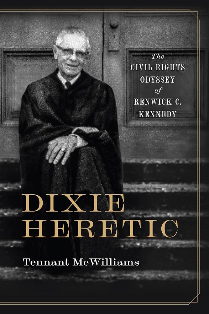 Cover of the book *Dixie Heretic*. A vintage photo of Renwick Kennedy with his name and title in bold typeface.