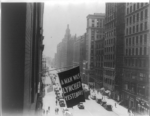 Flag, announcing lynching, flown from the window of the NAACP headquarters on 69 Fifth Ave., New York City, https://www.loc.gov/pictures/item/95517117/